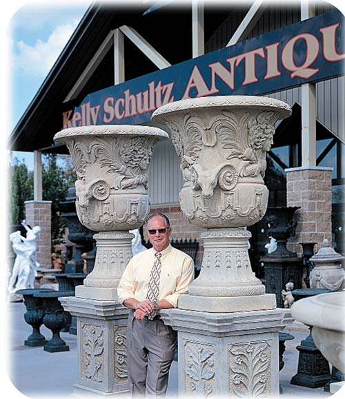 A picture of Kelly Schultz standing outside Kelly Schultz Antiques shop in Clarence, NY